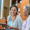 Healthcare professional talks with patients