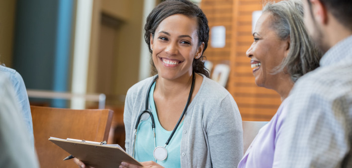 Healthcare professional talks with patients