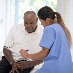 An Elderly Gentleman in His Doctors Office Receiving a Check-Up