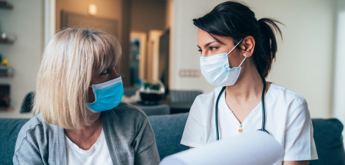 Female doctor consults mature patient during the quarantine for coronavirus