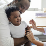 Baby getting a first injection