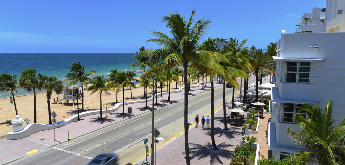 Sunrise Beach in Ft.Lauderdale with palm trees and beach entry feature.