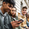 Teenagers students using smartphone on a school break