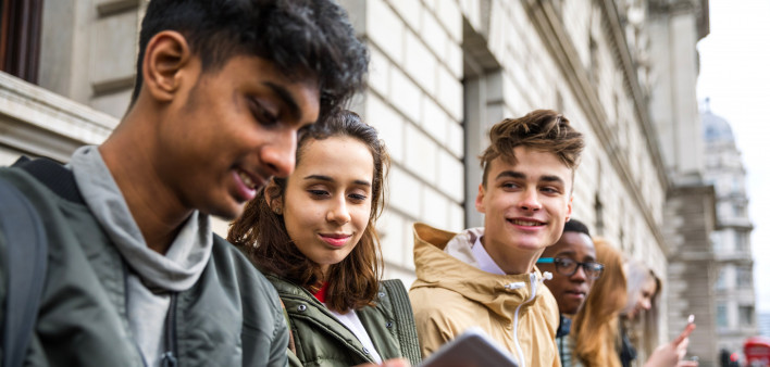 Teenagers students using smartphone on a school break