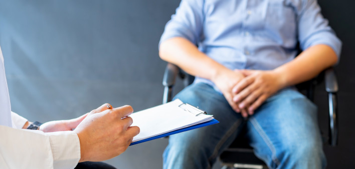 Male doctor and prostate cancer patient are discussing about prostate cancer test report. Diagnostic, prevention of men diseases,
