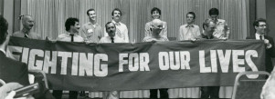 AIDS activists unfurl a banner at the National Lesbian and Gay Health conference in June 1983 in Denver.