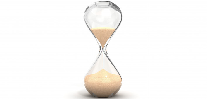 an hourglass with sand running downwards