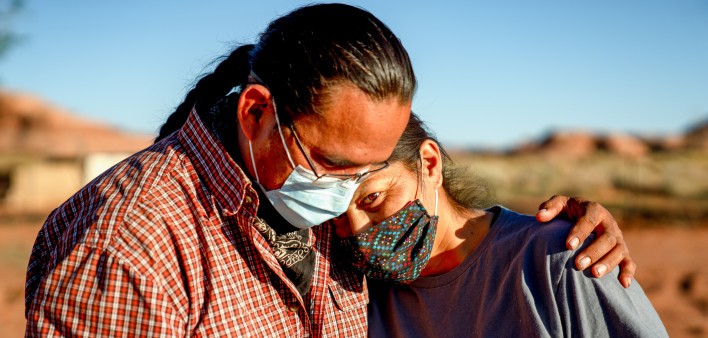 A Navajo husband and wife encourage one another because of the Coronavirus curfew by the Tribal Council in Arizona
