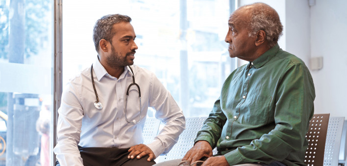 doctor taking to patient