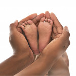 Hands and baby feet