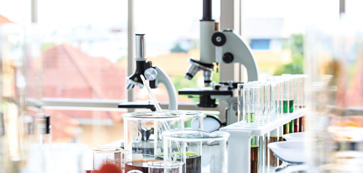 beakers and microscopes in laboratory