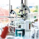 beakers and microscopes in laboratory