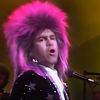 Elton John sings “Bennie and the Jets” in 1986.