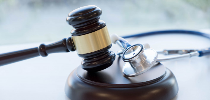 Gavel and stethoscope. medical jurisprudence. legal definition of medical malpractice. attorney. common errors doctors, nurses and hospitals make