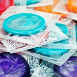 pile of mulit color condoms in clear plastic wrapers
