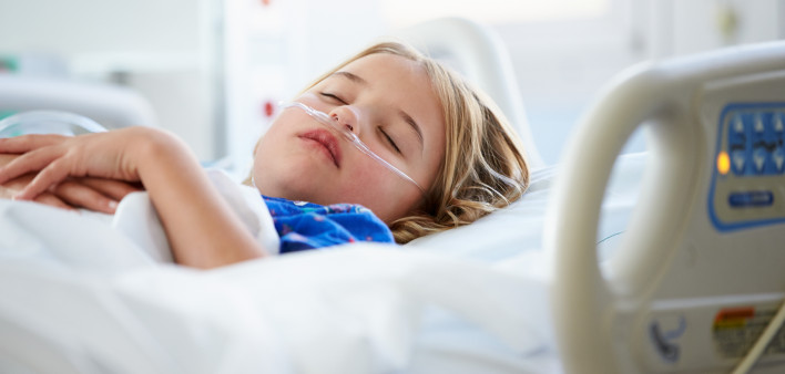 Young Girl Sleeping In Intensive Care Unit
