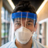 EIS Officer Guillermo “Memo” Sanchez wears a protective gown and face shield during an April 2020 visit to a Detroit nursing home.