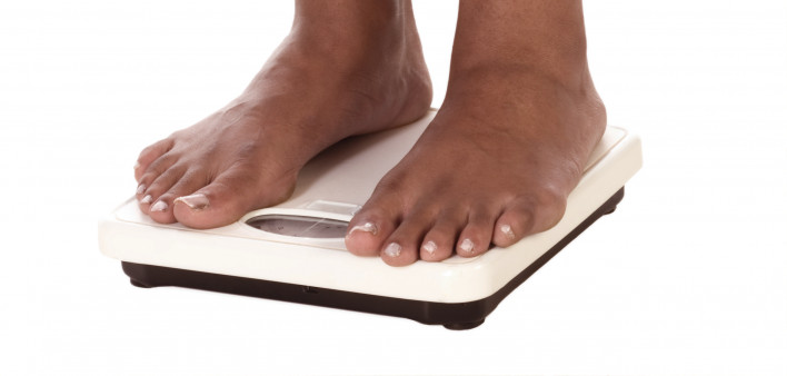standing on scale weight