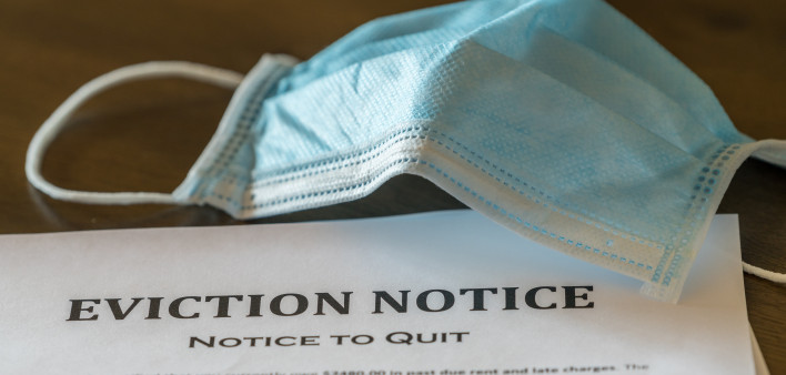 Official legal eviction order or notice to renter or tenant of home with face mask