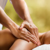 Young woman enjoying massage in spa