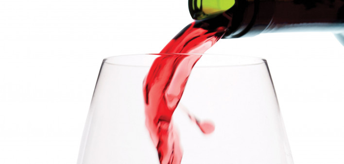 red wine pouring into glass
