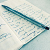 pen and journal with writing