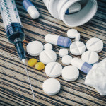syringe and pills