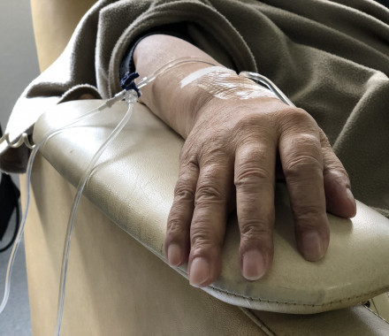 Unidentified hand connected to a chemo therapy treatment