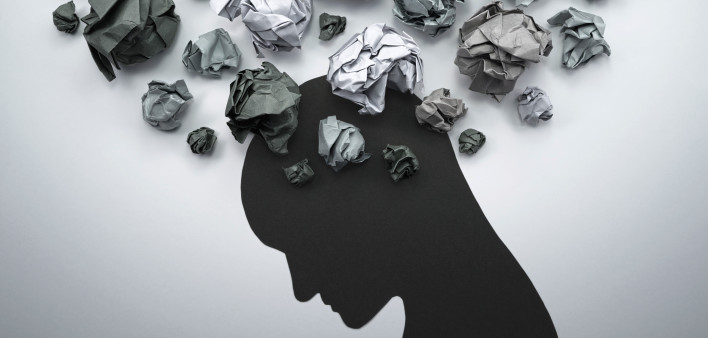 illustration of depression silhouette of head with crumpled paper above