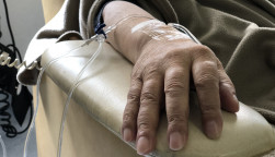 Unidentified hand connected to a chemo therapy treatment
