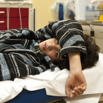 Teenager in a hospital emergency room looking at the camera, could be for overdose, alcohol, depression, accident or any other medical condition