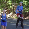 Julie Mizraji accompanied by her brother on his unicycle