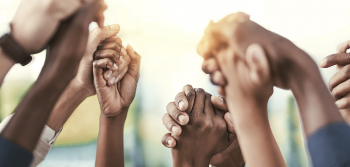 black hands held up and grasping