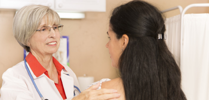 Mid-adult, latin descent woman receiving her annual breast exam from her gynocologist doctor at hospital or clinic. Senior adult, female doctor. Women's health, issues. Breast cancer awareness. (75 kB)